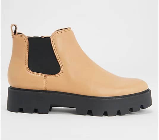 image of a dark beige lug boot with ankle height and chunky black sole