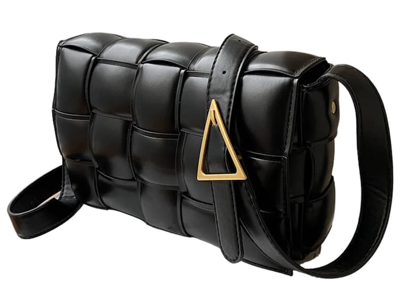 image of a back padded vegan leather bag with woven pattern and a triangle gold buckle on the strap