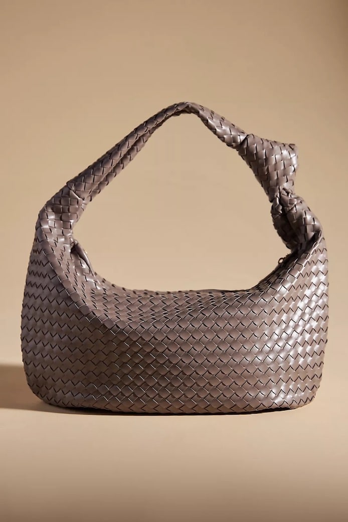 a woven hobo satchel bag in taupe that's a dupe of the Bottega Veneta Maxi Jodie bag