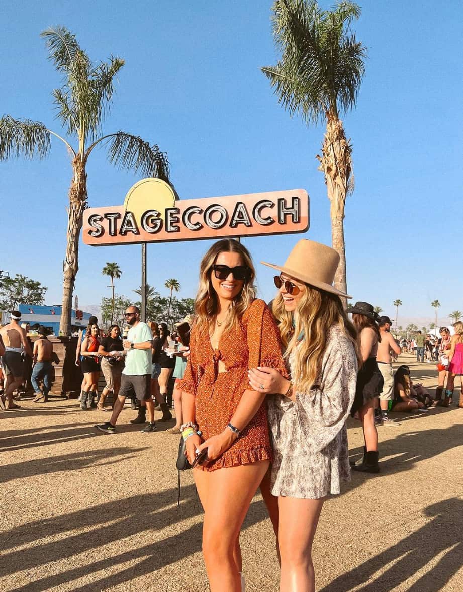 Two women wearing boho chic rompers at the Stagecoach music festival