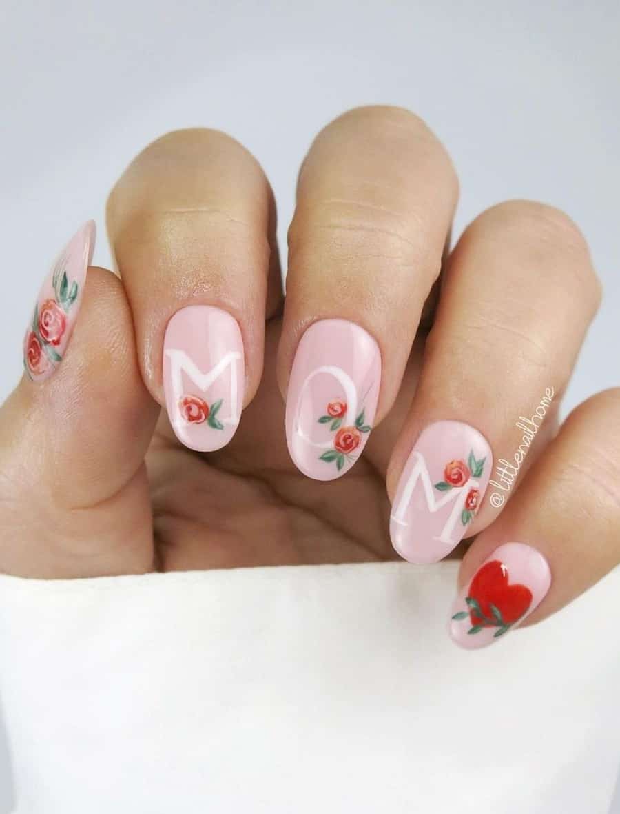 image of a hand with a pink manicure with roses and the word "mom"