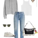 image of an outfit for Disney World with blue jeans, a white tank, sneakers, and a knit hoodie with Minnie mouse earrings