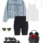 image of an outfit for Disney World with black biker shorts, a white tank top, a denim jacket, a Kate Spade Minnie purse, Minnie Mouse earrings, and black sandals