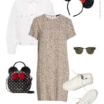 image of an outfit for Disney World with a t-shirt dress, white denim jacket, canvas sneakers, a black Kate Spade Minnie purse, Minnie Mouse ears and sunglasses