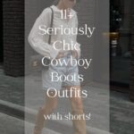 A woman wearing light-washed denim shorts with tan suede cowboy boots, a white button-up, and a black shoulder bag with text overlay "11+ seriously chic cowboy boots outfits'
