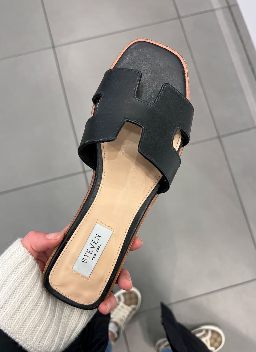 image of a black sandal that is a dupe of the Hermes Oran sandal