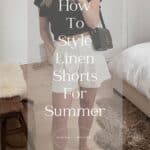 woman wearing a black top, brown belt, white linen shorts, and brown sandals with text overlay "how to style linen shorts for summer"