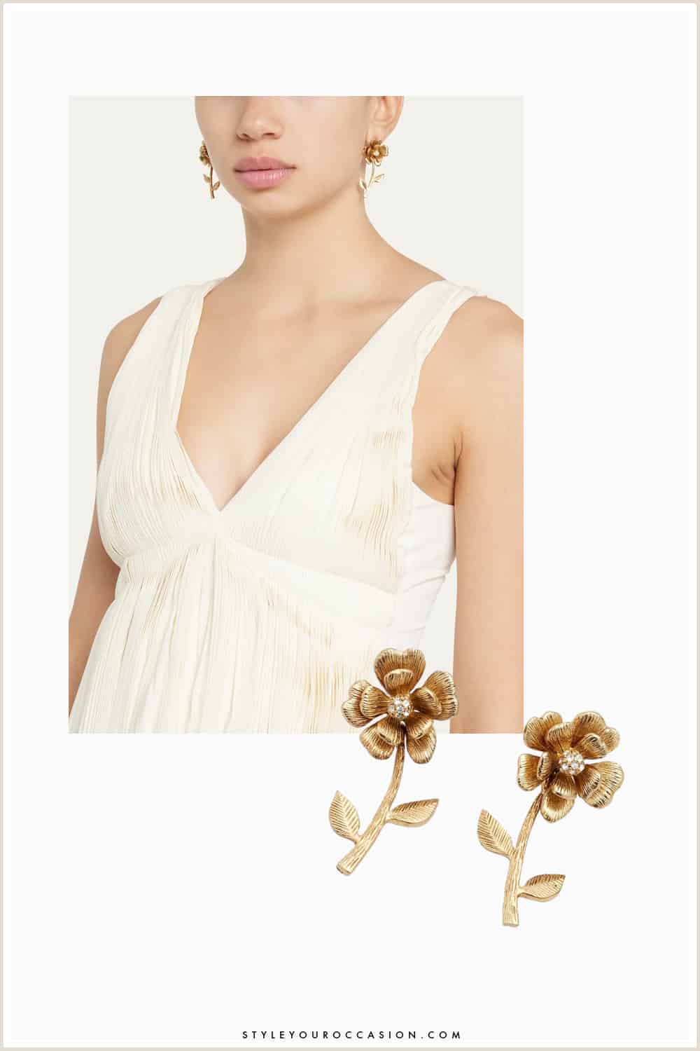 image of a woman wearing gold dancing flower earrings and an ivory silk tank top