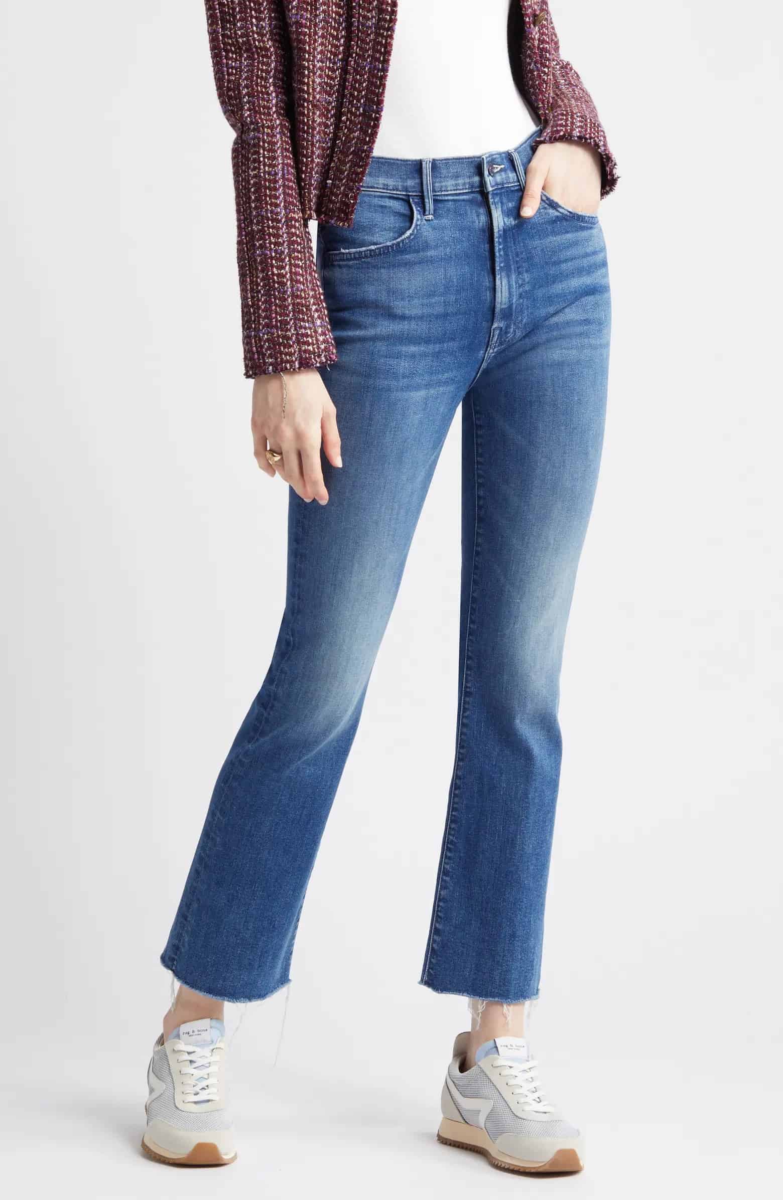an image of medium washed frayed bootcut jeans from Mother