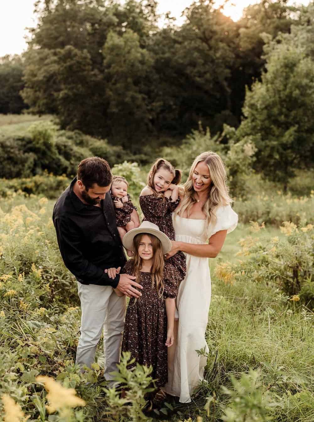 family photoshoot in the fall with the people wearing neutral colors and neutral floral dresses