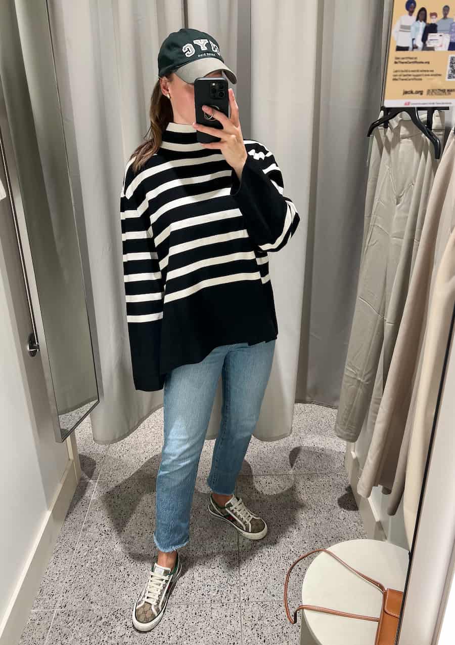 Christal wearing a striped Toteme dupe turtleneck sweater at H&M with jeans and sneakers