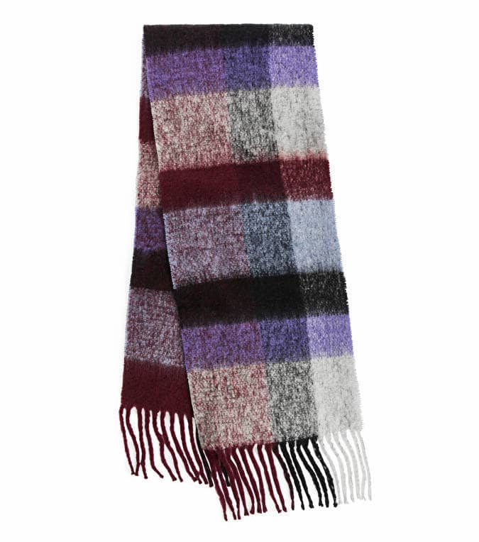 A blue, purple, red, and white plaid Acne Studios scarf dupe from Arket with fringed ends