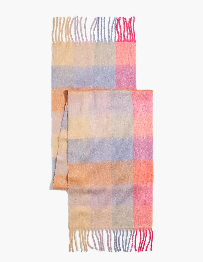 A pink, blue, purple, and orange plaid Acne Studios scarf dupe from Madewell with fringed ends