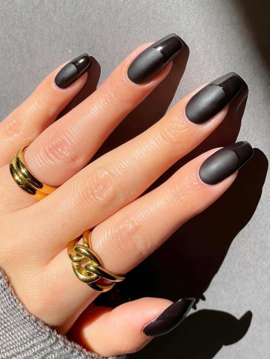 Matte black long, square mails with glossy black french tips.