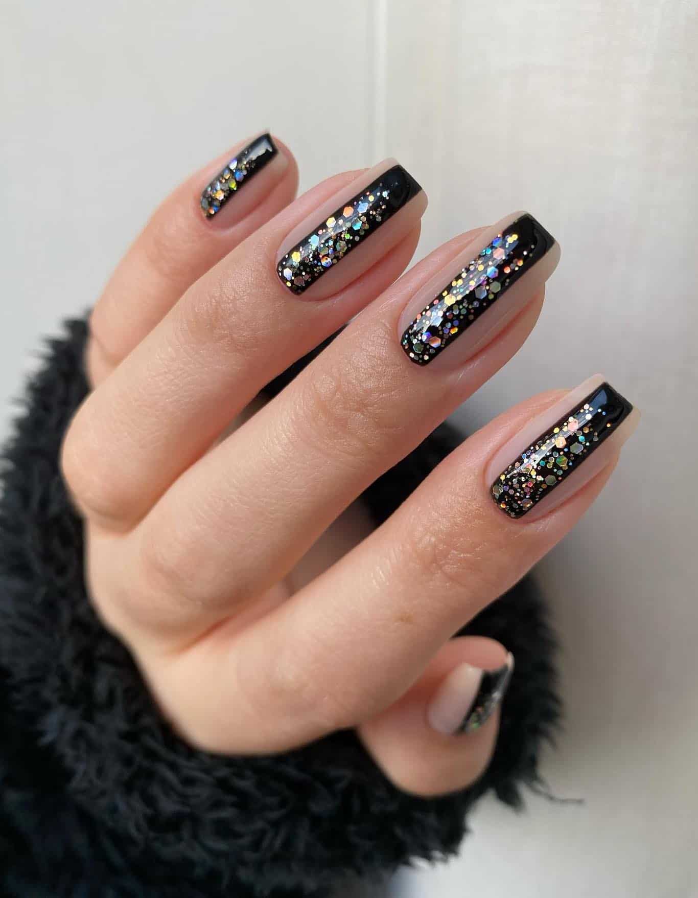 Short square nude nails with vertical black and glitter stripes