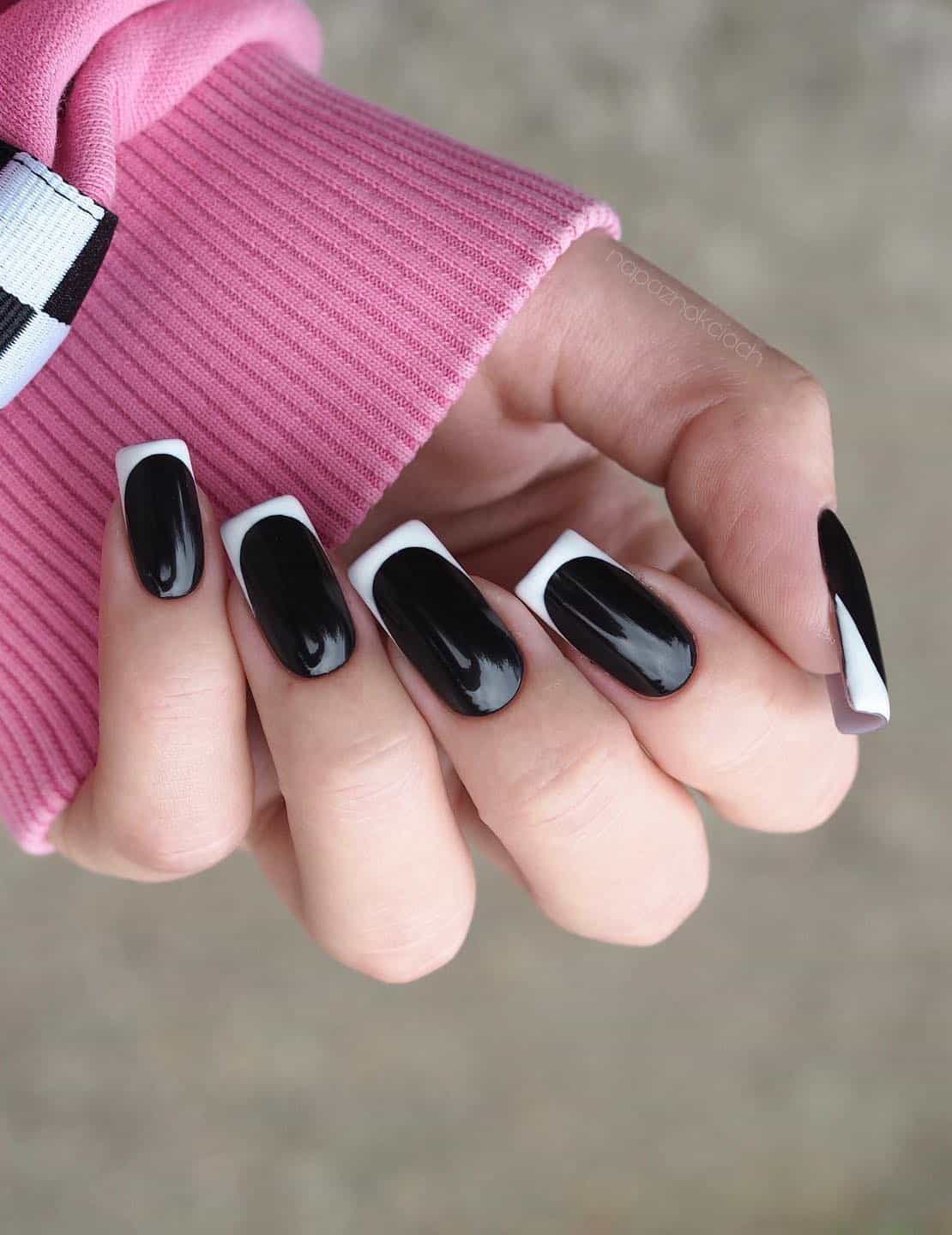 Medium square nails with glossy black polish and white French tips