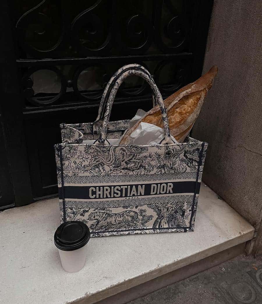 A black and white patterned Christian Dior tote