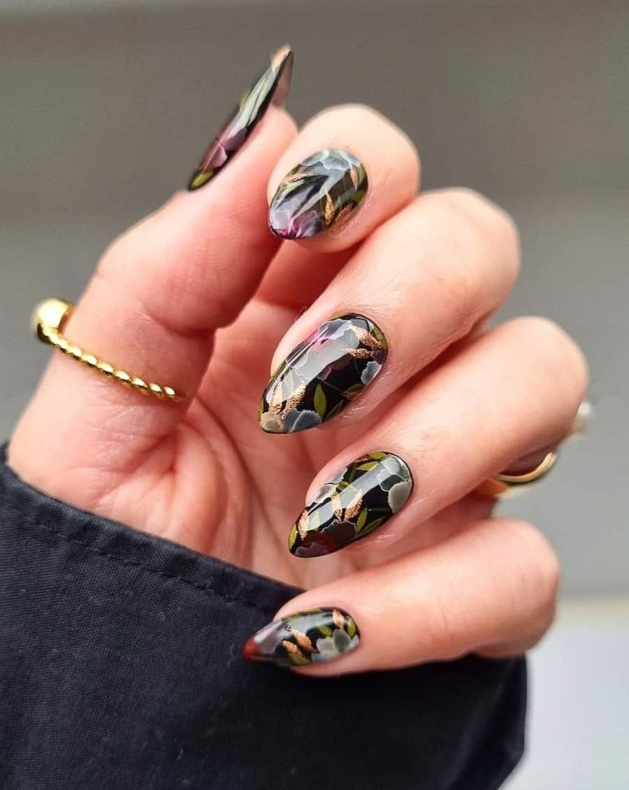 Short stiletto nails with black polish and floral nail art