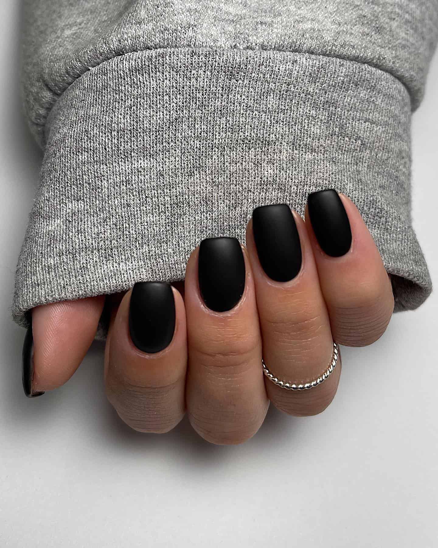 Short square nails with matte black polish