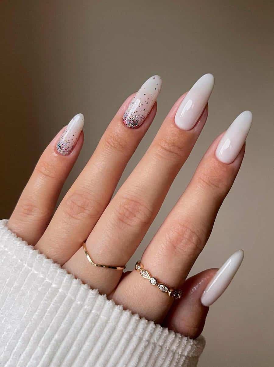 Long milky white almond nails with glitter ombre accent nails