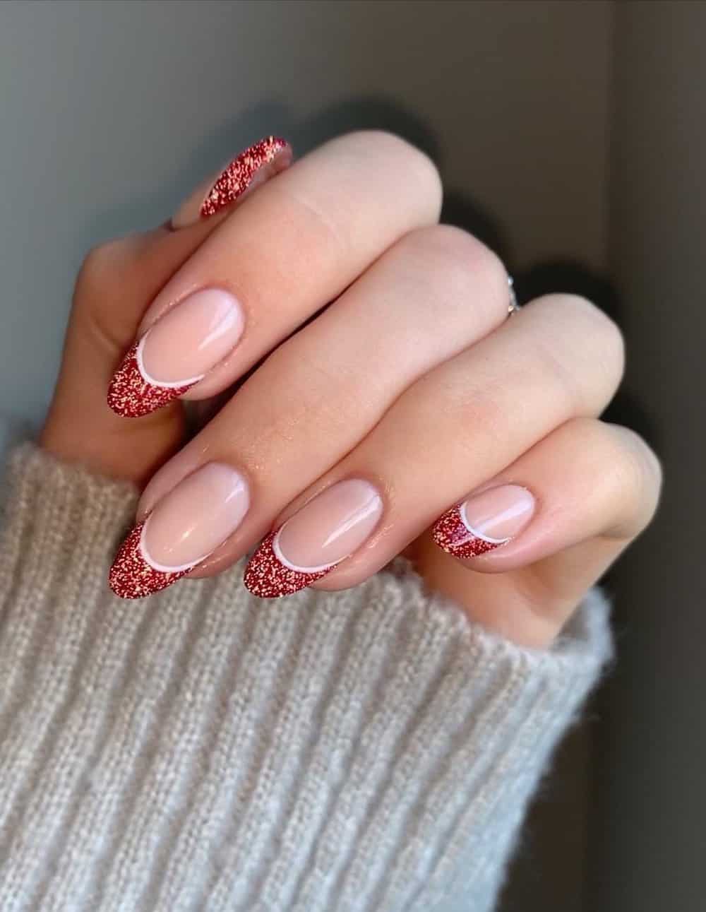 Red glitter french tip manicure.