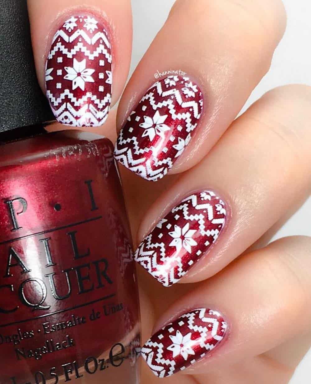 Red glitter and white Christmas sweater manicure.