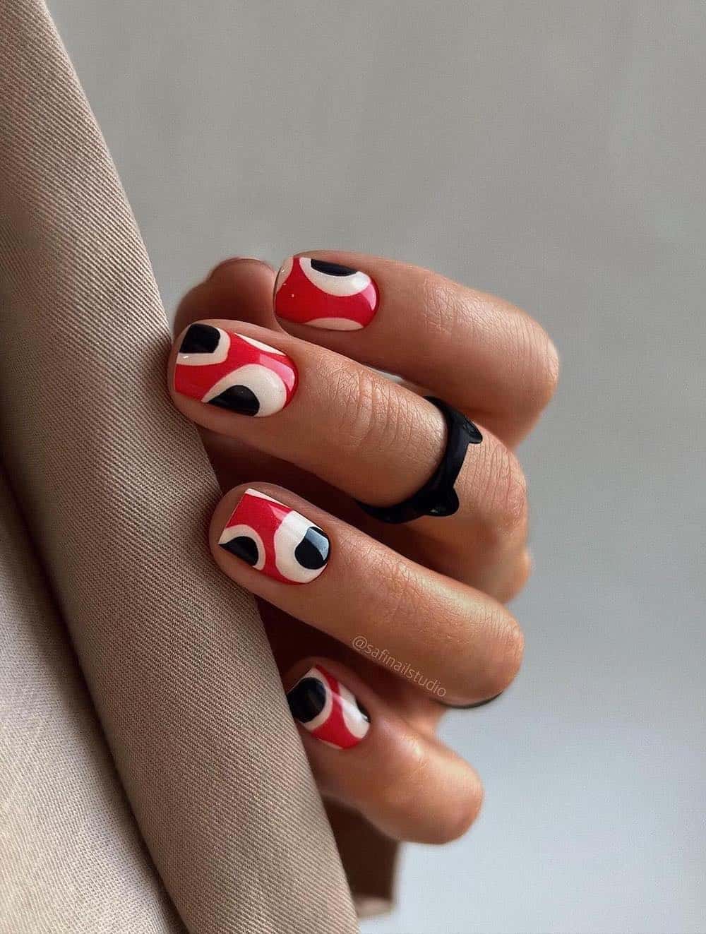Red, white and black polka dot manicure.