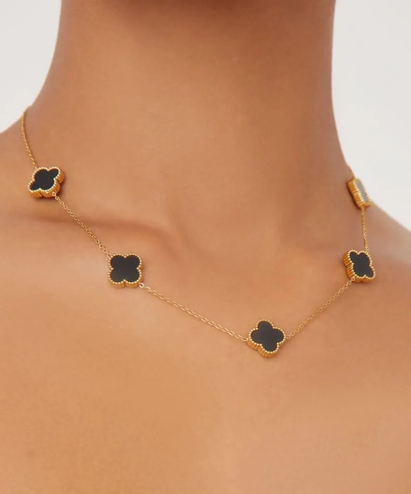 An image board of a Van Cleef necklace dupe from Ego in black and gold