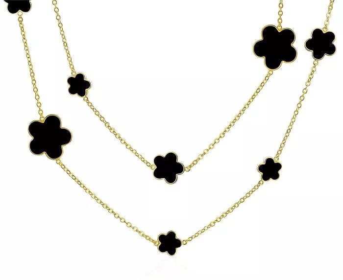 An image board of a dupe for a Van Cleef necklace from Macy's in black and gold
