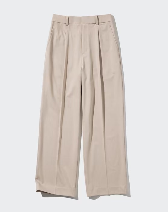 Image of a pair of light beige wide-leg pleated trousers
