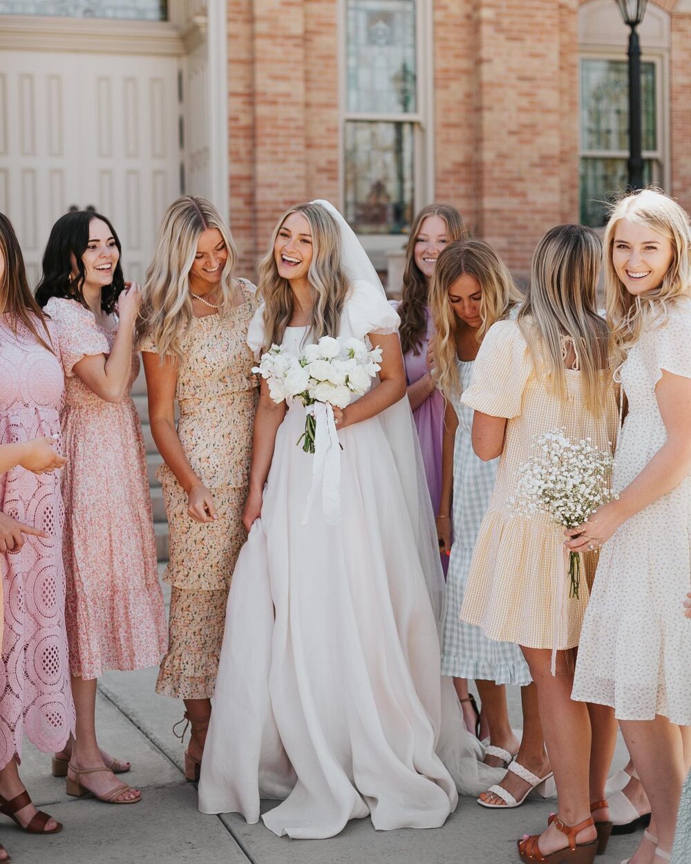 image of a group of women at a wedding wearing pretty dresses next to a beautiful bride