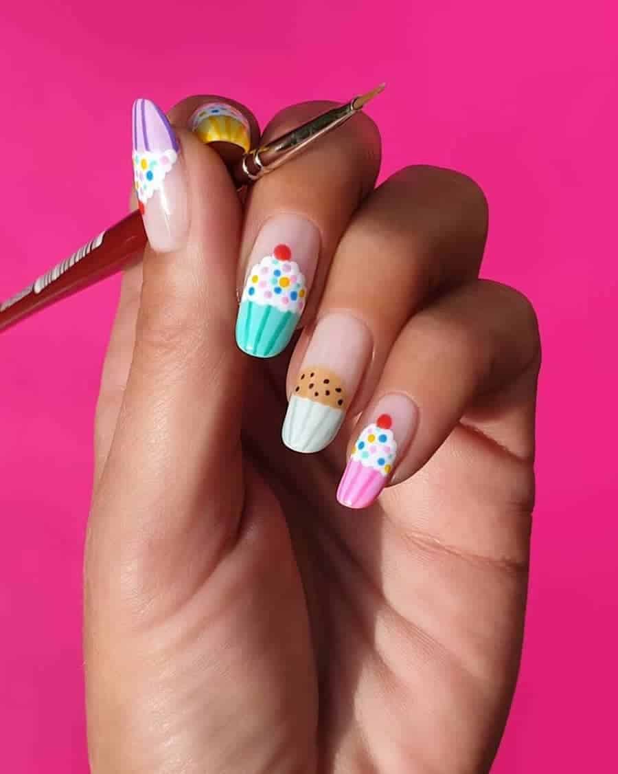 Long round nude nails with colorful cupcake nail art tips
