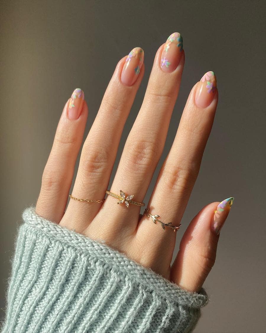 Short round nude nails with colorful floral art