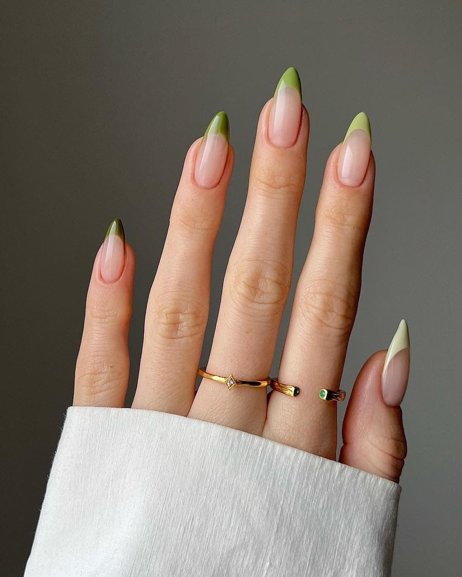 Long nude almond nails with gradient green tips