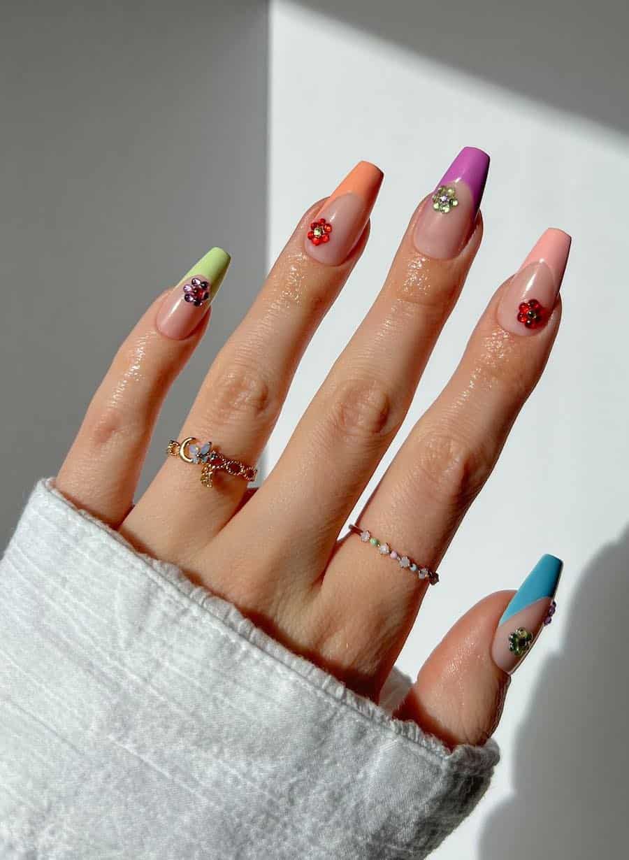Long nude coffin nails with colorful pastel tips and gem floral designs