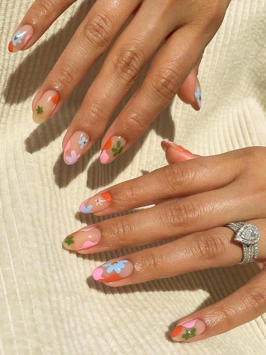 Short nude almond nails with colorful waves and retro floral art
