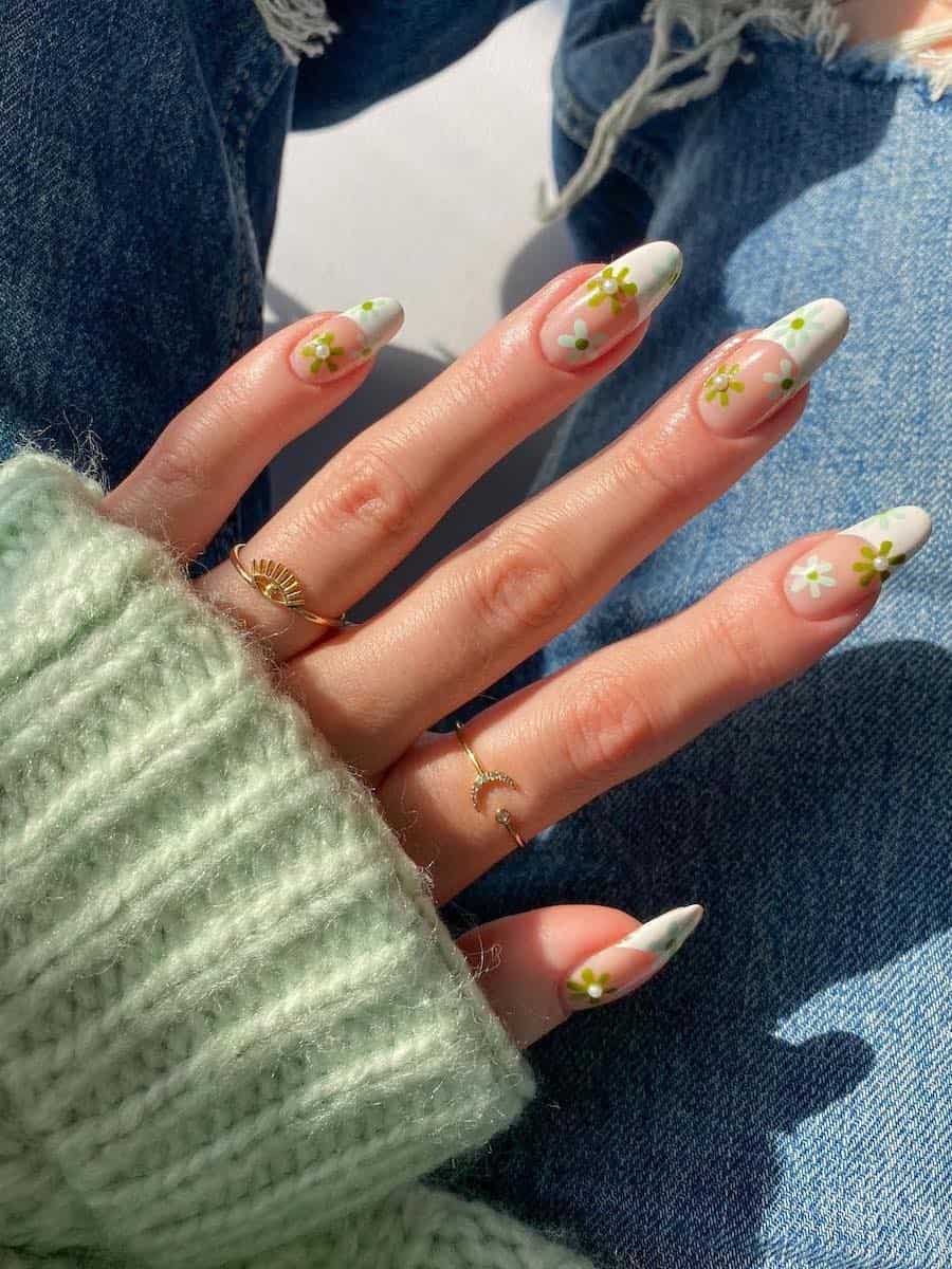 Long nude almond nails with white tips and blue and green retro flowers