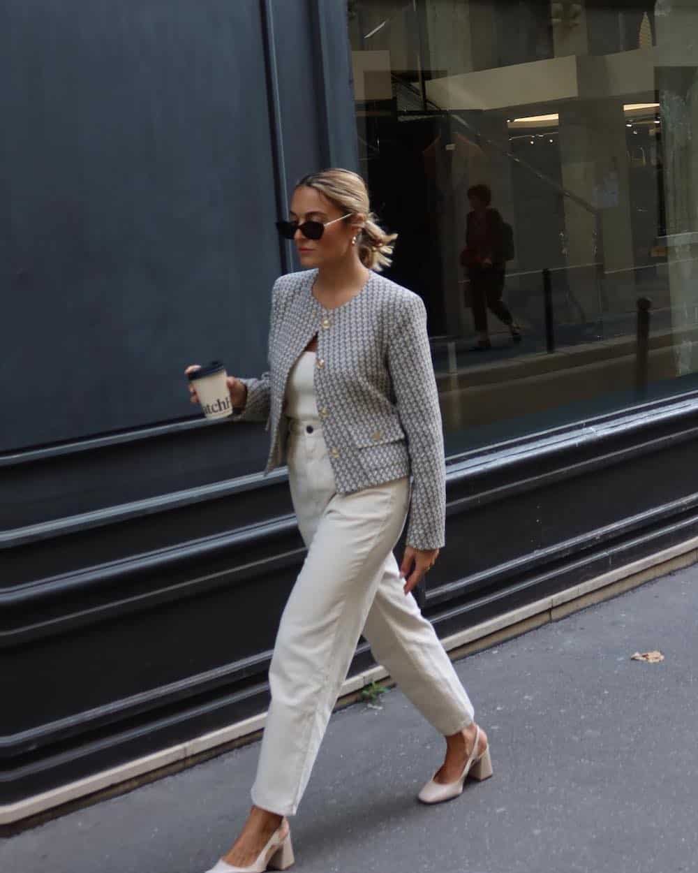 Woman wearing white jeans with tan Mary Jane heels and a tweed lady jacket.