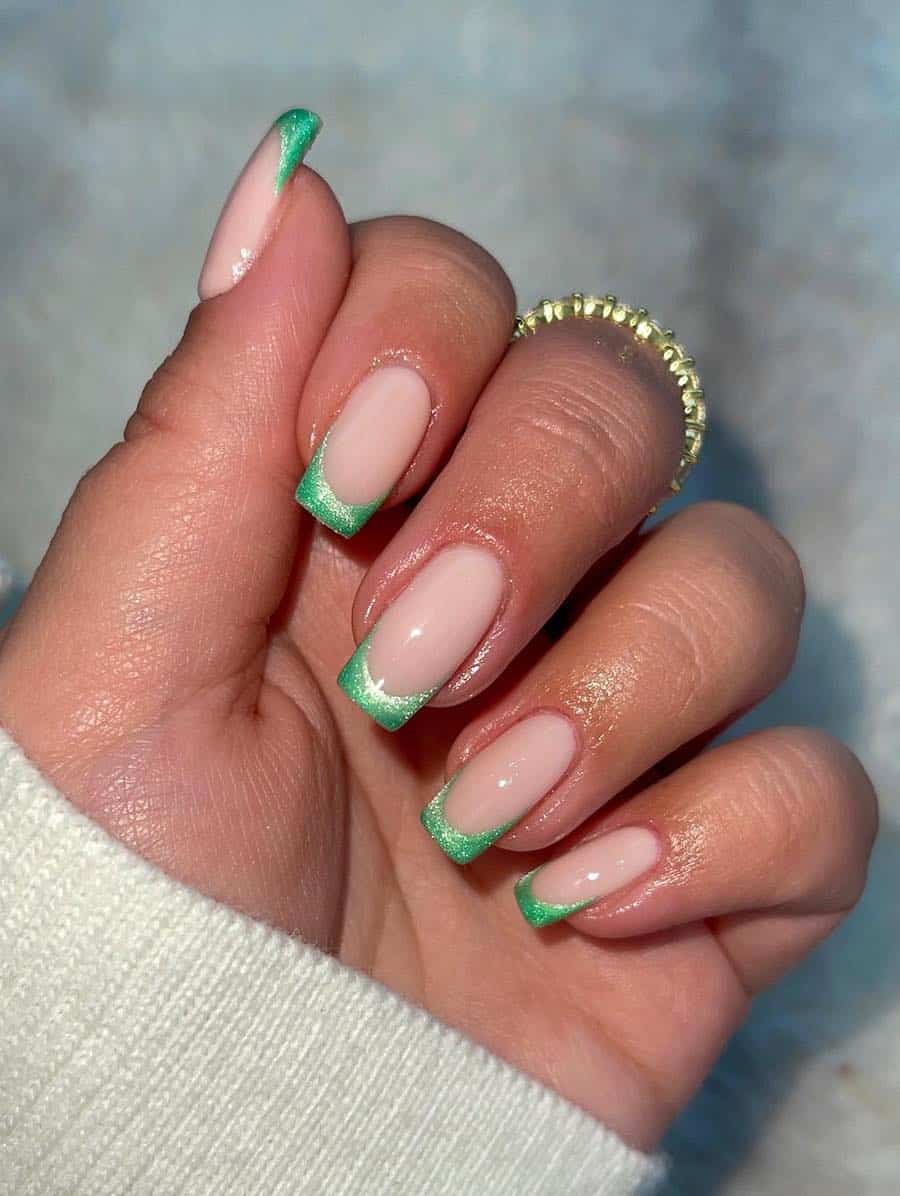 Medium square milky white nails with green velvet tips