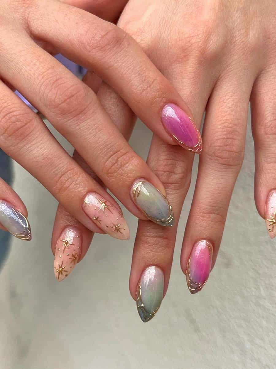 Medium almond nails painted in shades of pink, green, blue, and nude with gold accents