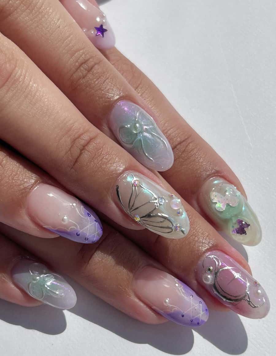 Short round nails with shimmering pastel shades and silver nail including bows, fairy wings, and other feminine details