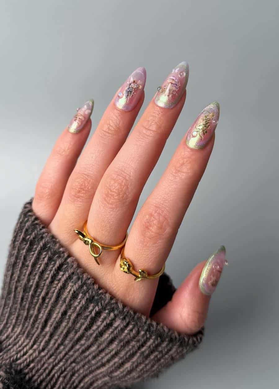 Long almond nails painted with shimmering pastel nail polish with fairy core nail stickers and pearl accents