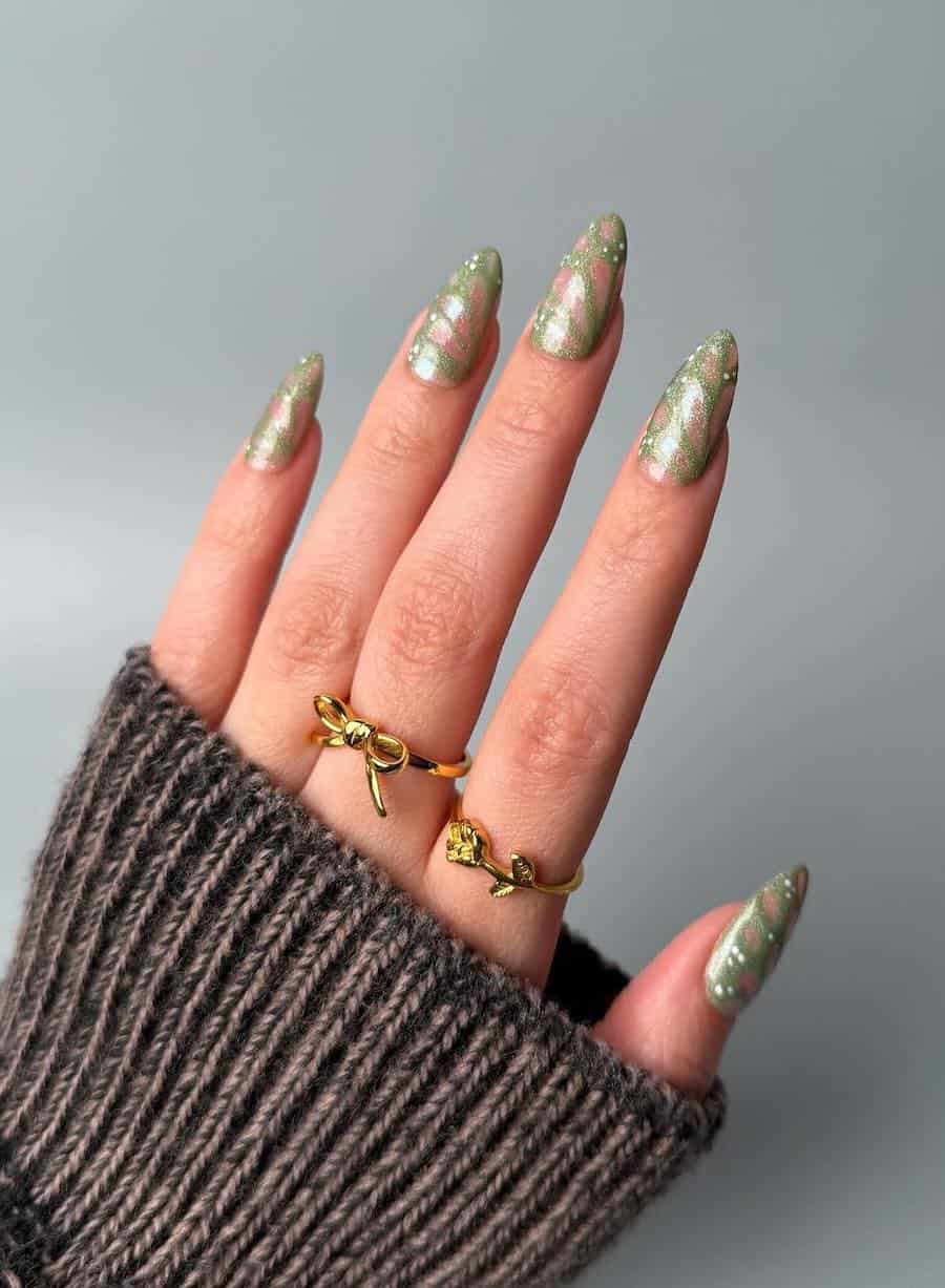 Long almond nails painted like green butterfly wings
