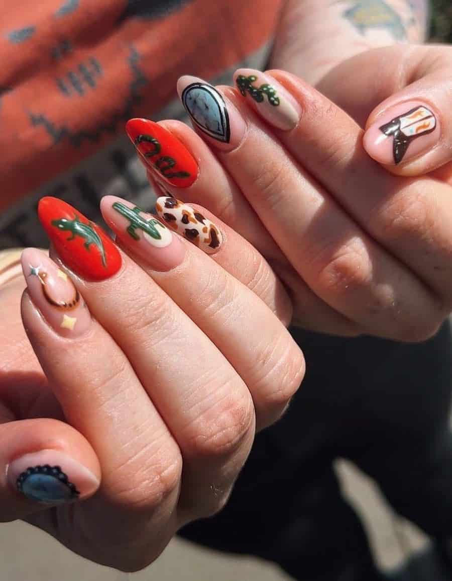 Medium round nails featuring lizards, cactus, cow print, and other Western-inspired nail art