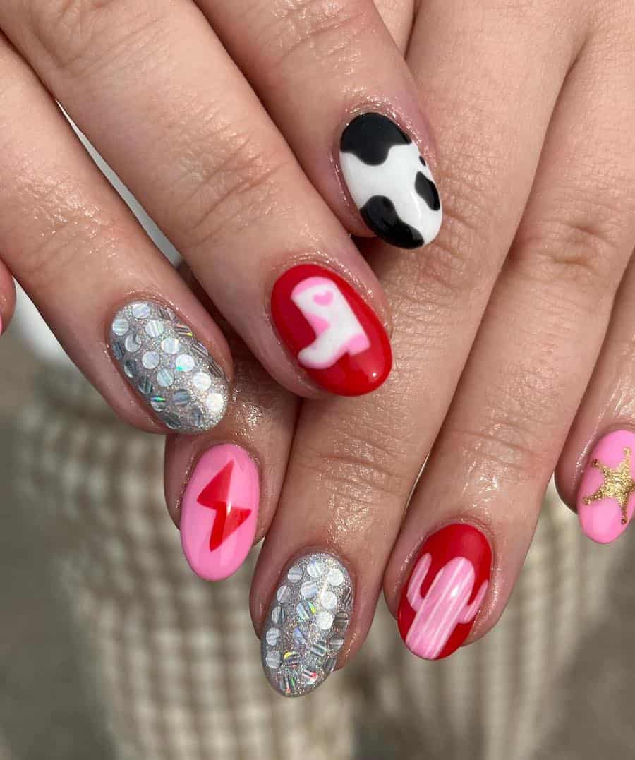 Short round nails featuring silver glitter nails, cow print, and cowgirl boots