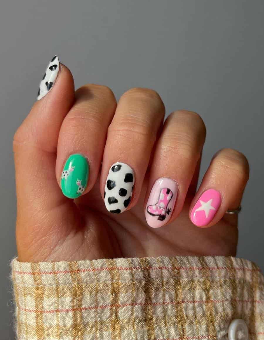 Short round Western-themed nails featuring cow print, cowgirl boots, and cow nail art