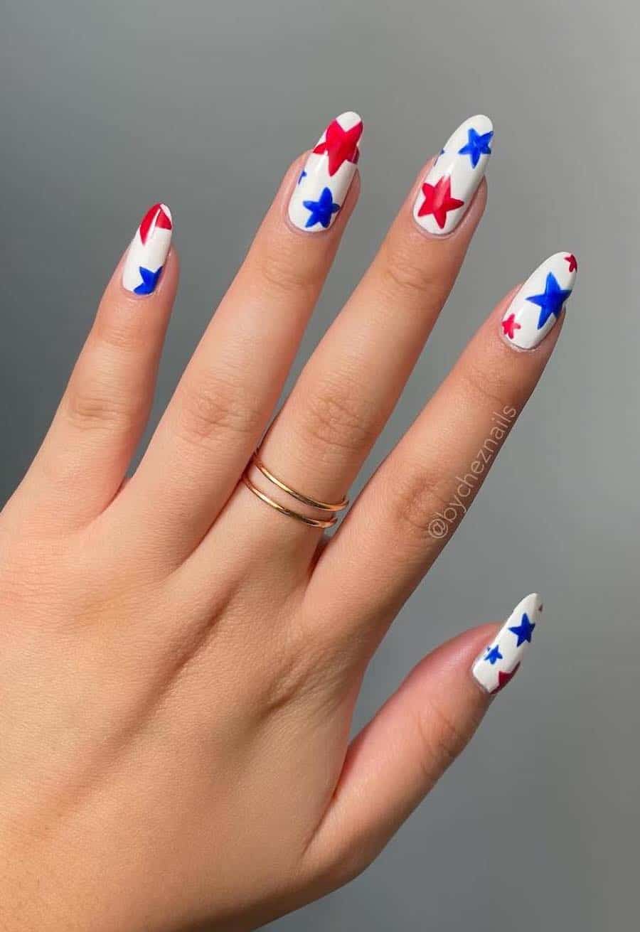 long white almond nails with red and blue stars