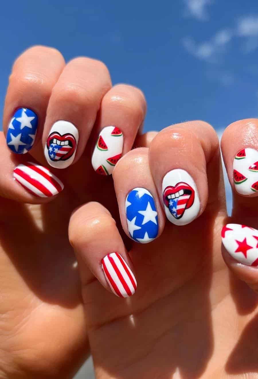 short round nails featuring fun fourth of july nail art including stars, stripes, watermelon, and a mouth with an American flag tongue sticking out