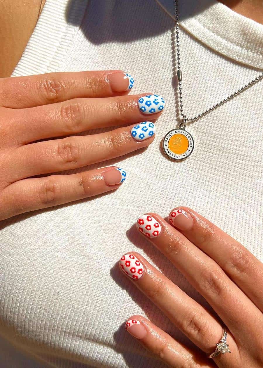 short round white nails with blue and red retro flowers and French tip accent nails