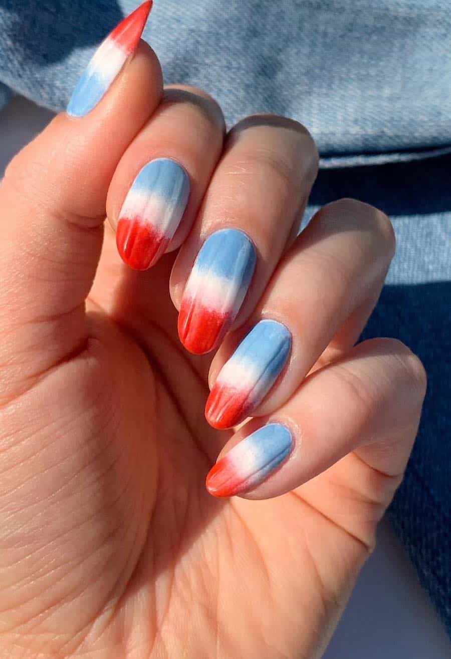 medium round nails featuring red, white, and blue popsicle ombre art